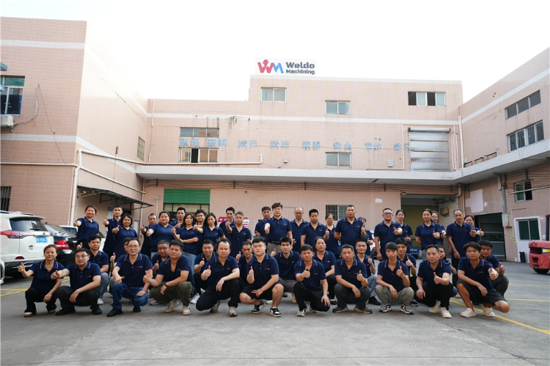 Recent group photo of some Weldo employees and their boss