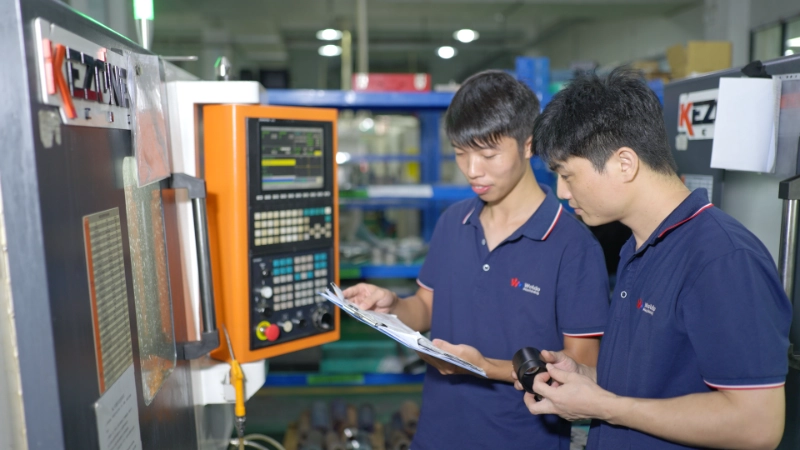 Workers on the production line checking quality and standards